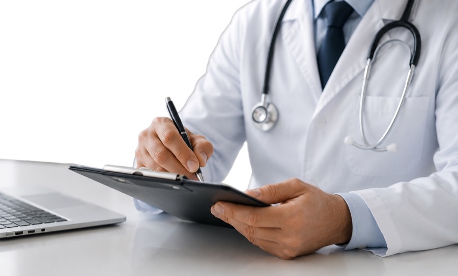 A licensed physician writing a medical note